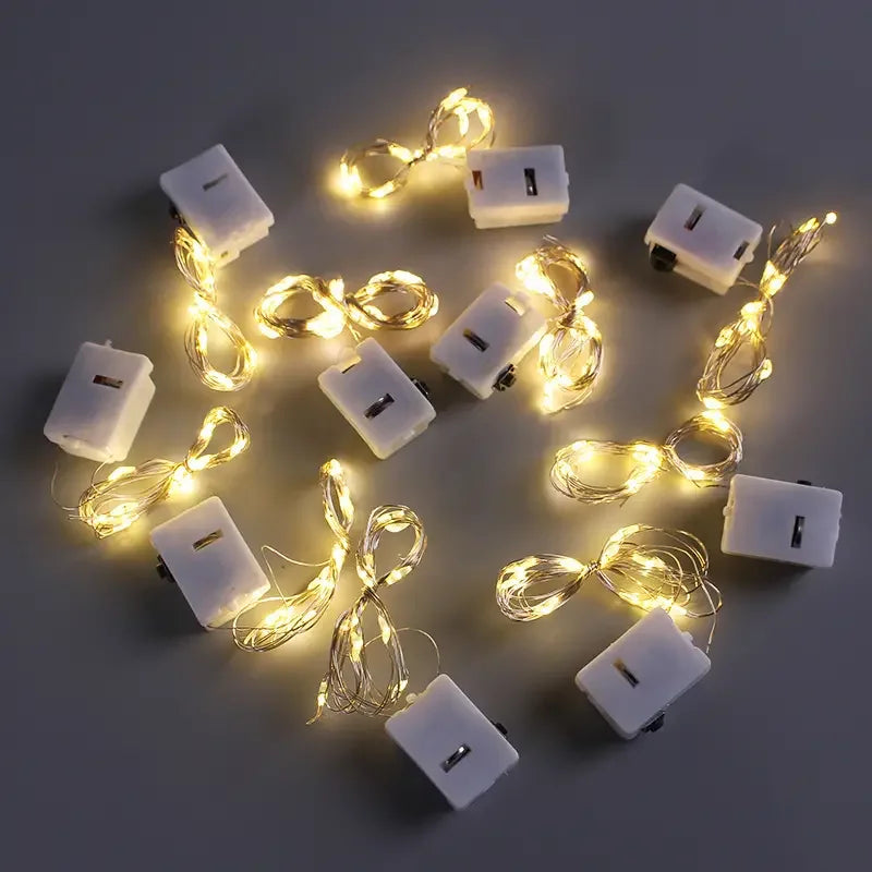LumiGlow LED-Lichterkette 10er-Set | Warmweiß | Batteriebetrieben & Wasserdicht | Flexibler Silberdraht für Deko, Hochzeit & Party